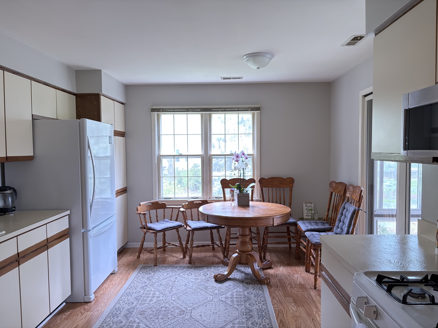318 Dunham Place Commons, Unit 318 St. Charles, IL 60174 - Photo 6 of 20 a view of a dining room with furniture and a window