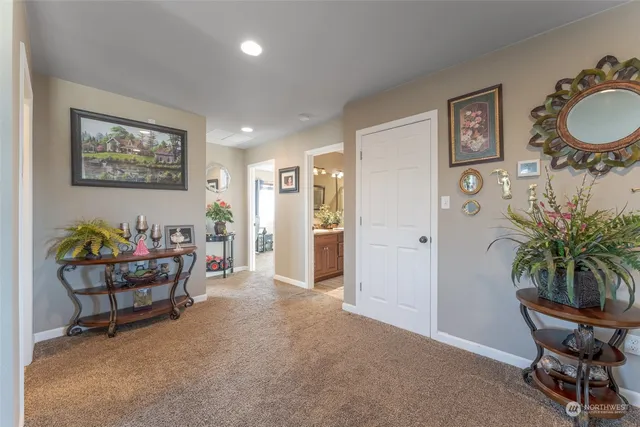 a living room with furniture and potted plant