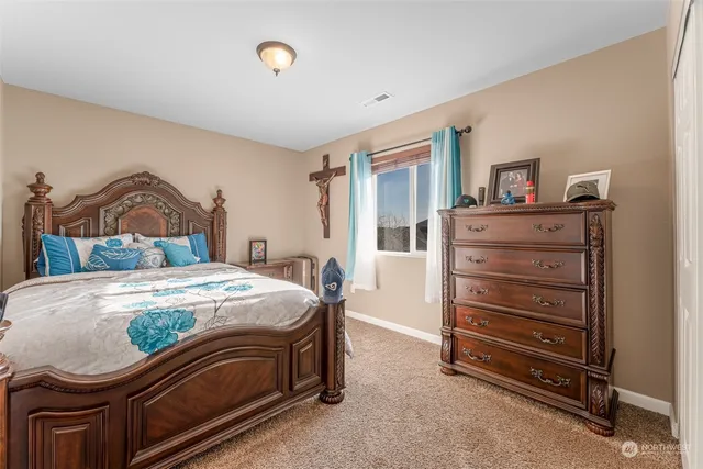 a bedroom with a bed and a closet