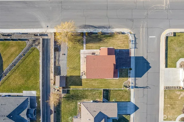 an aerial view of residential houses with outdoor space
