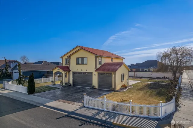 a view of house with outdoor space and sitting area