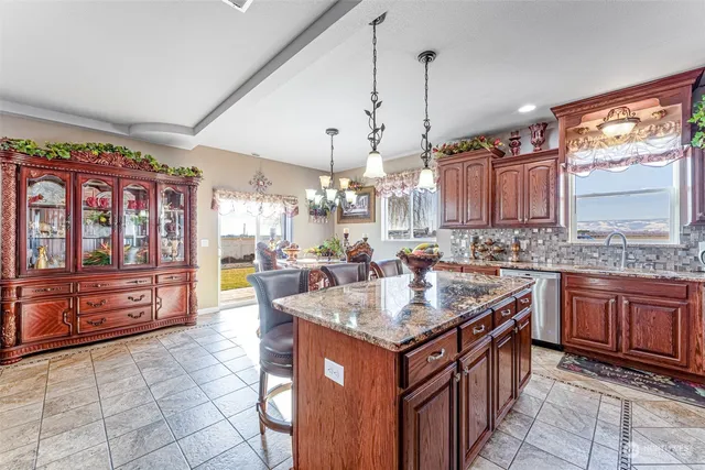 a kitchen with a stove a sink dishwasher and a microwave oven