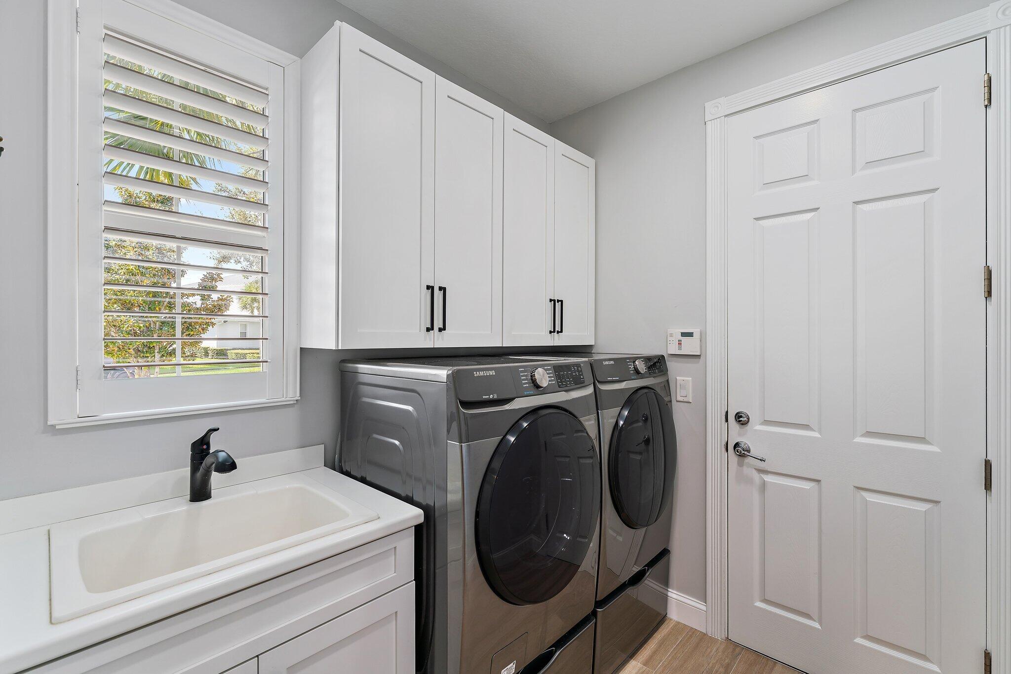 1169 Tropical Drive Jupiter, FL 33458 - Photo 59 of 113 Downstairs Laundry Room