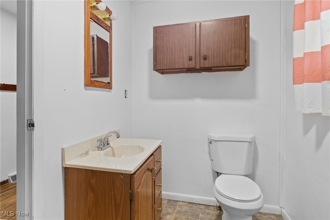 102 Potrock Road Wellsburg, WV 26070 - Photo 13 of 42 Bathroom featuring vanity and toilet
