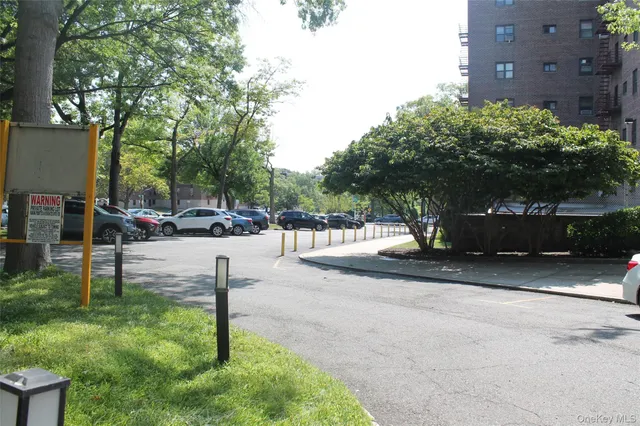 a view of street with parked cars