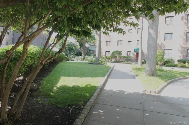 a view of a street with a building in the background