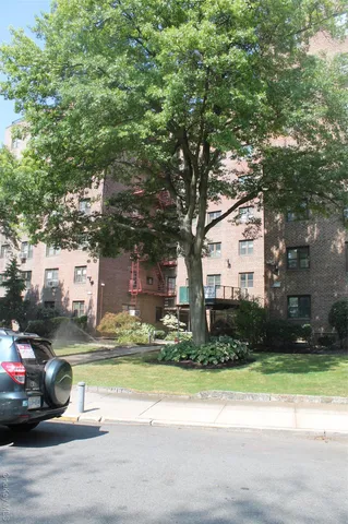 a view of a street with houses on both side