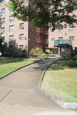 a swimming pool with outdoor seating and yard