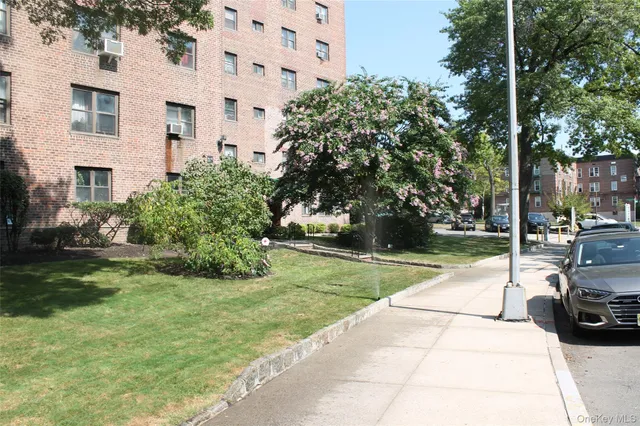 a view of a parked cars in front of a building