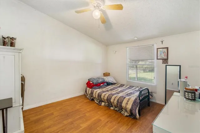a bedroom with a bed and window