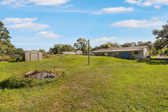 a view of a lake with a yard