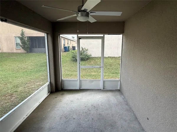 a view of room with window and floor to ceiling window