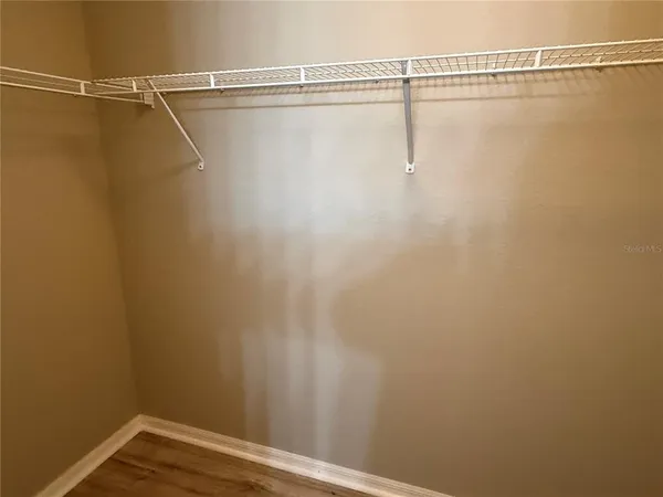 a view of a room with racks on the wall