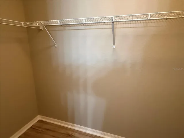 a view of a room with racks on the wall