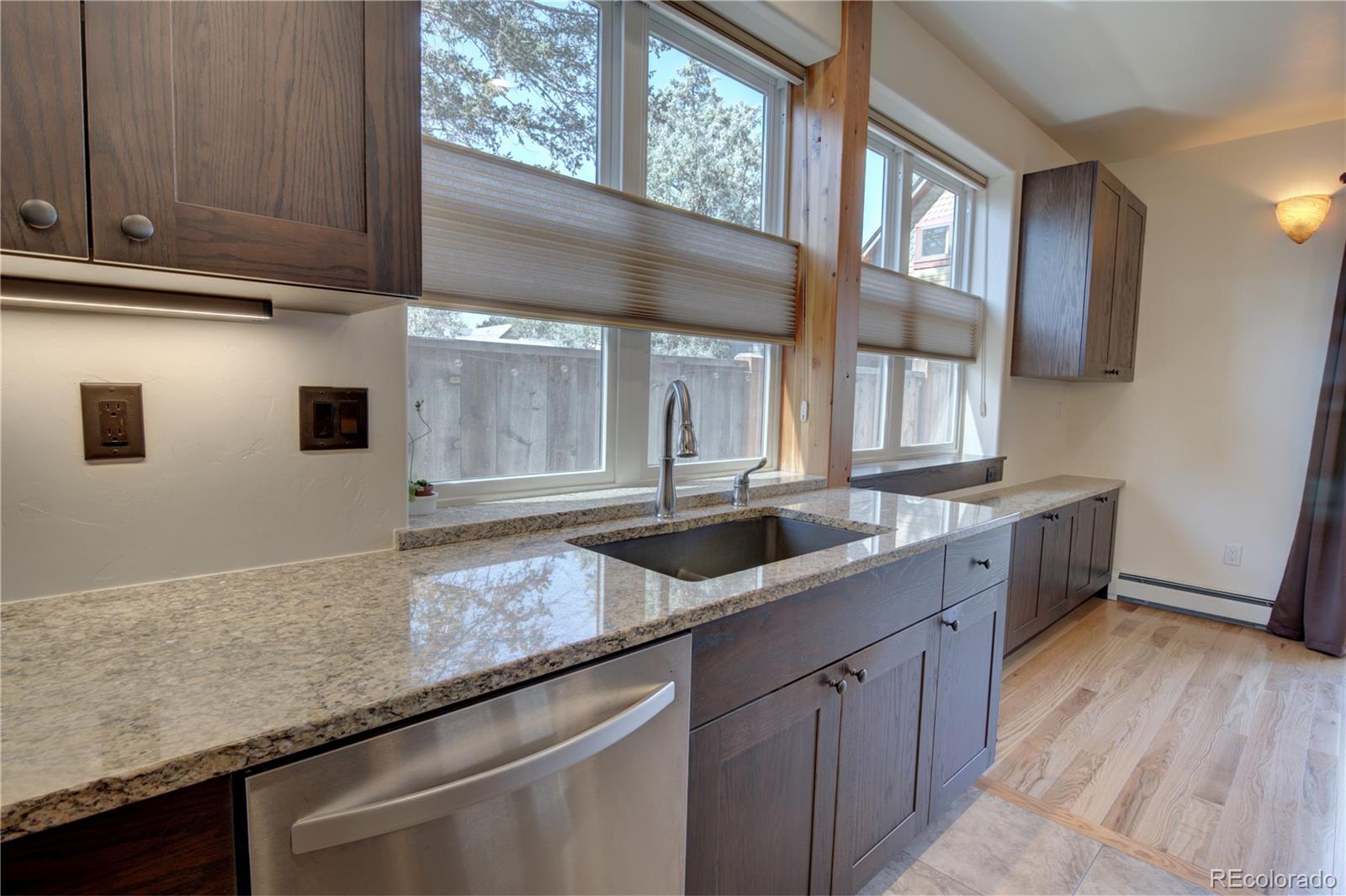 315 G Street Salida, CO 81201 - Photo 12 of 43 a kitchen with granite countertop stainless steel appliances sink and window