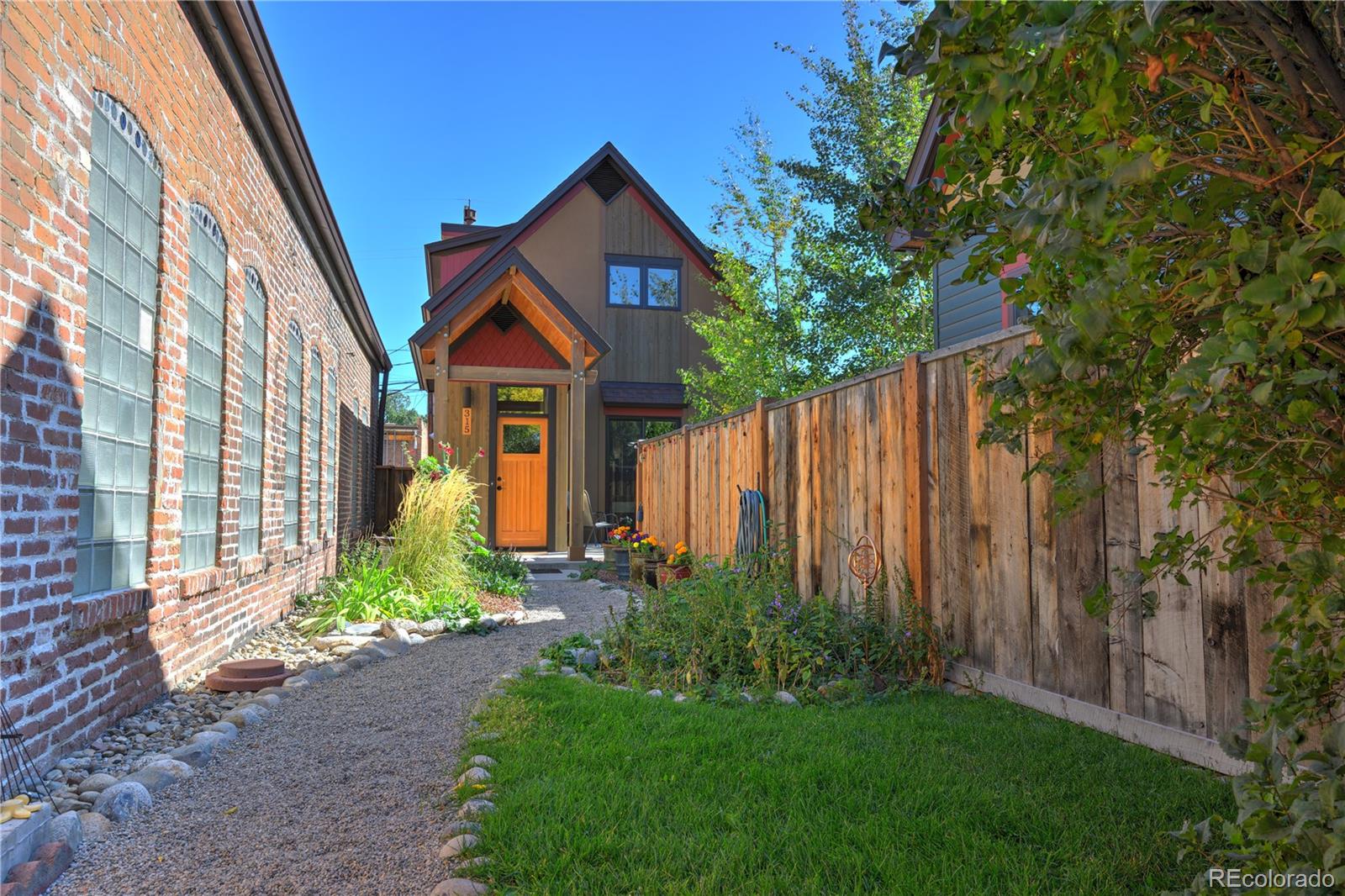 315 G Street Salida, CO 81201 - Photo 2 of 43 a front view of a house with garden
