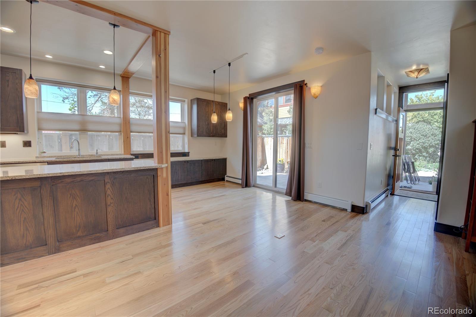 315 G Street Salida, CO 81201 - Photo 8 of 43 a large kitchen with granite countertop a large window a sink and stainless steel appliances