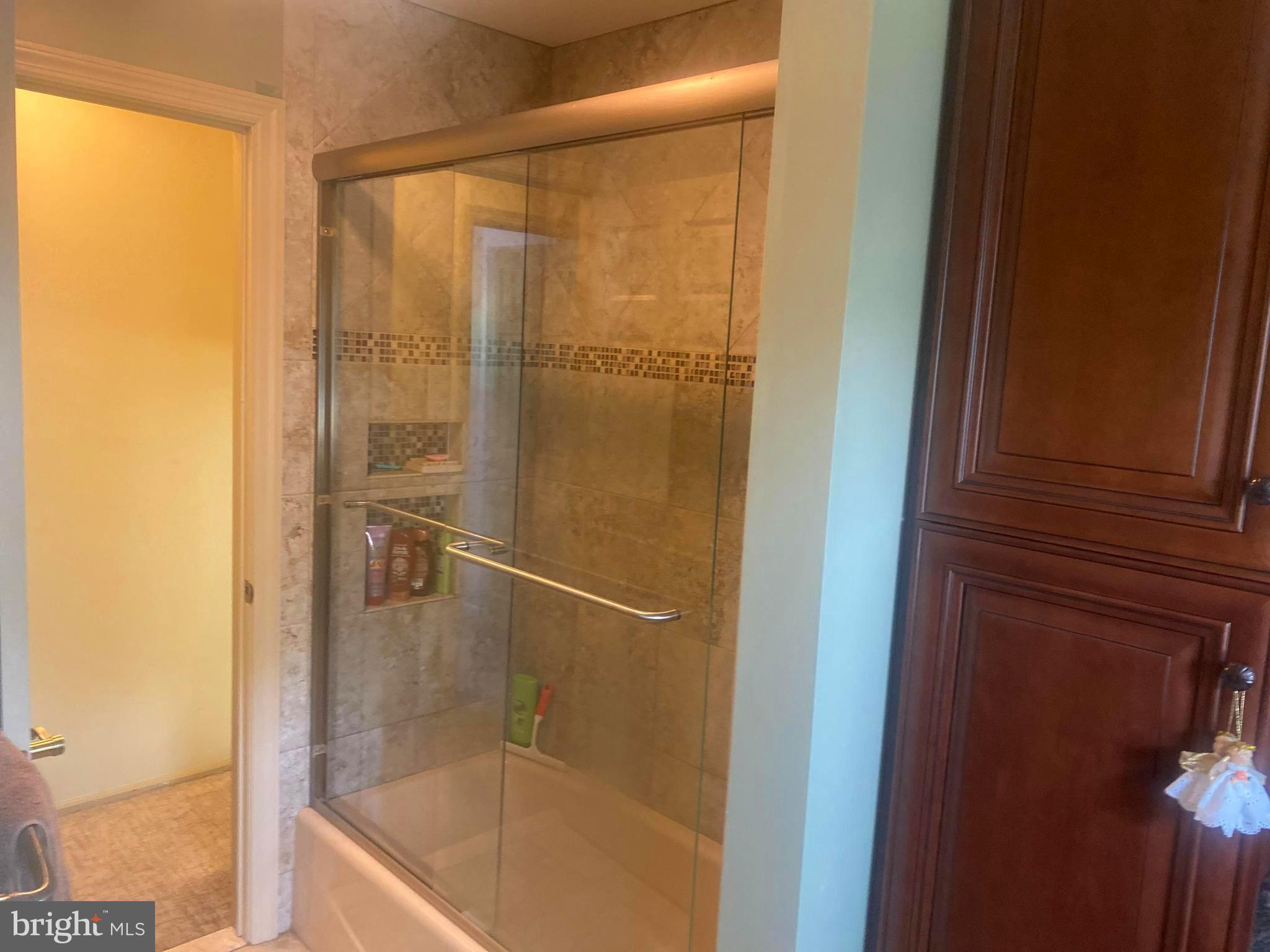 7 Galway Road Trenton, NJ 08620 - Photo 14 of 39 a bathroom with a glass shower door