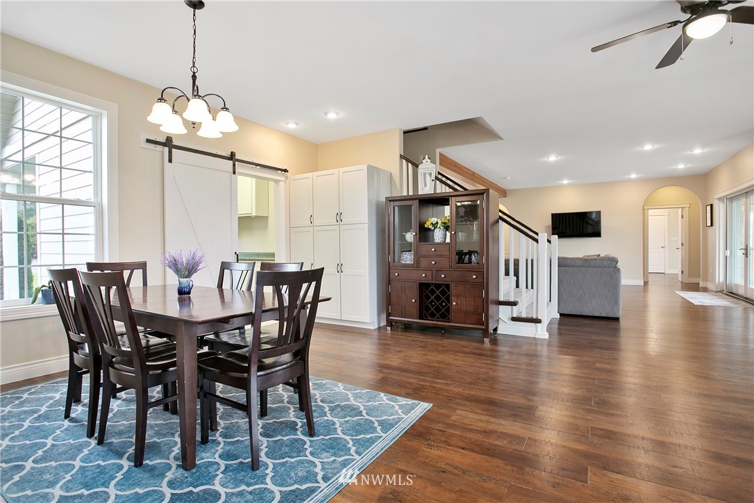 6580 Olson Road Ferndale, WA 98248 - Photo 11 of 38 a dining room with furniture entryway and wooden floor