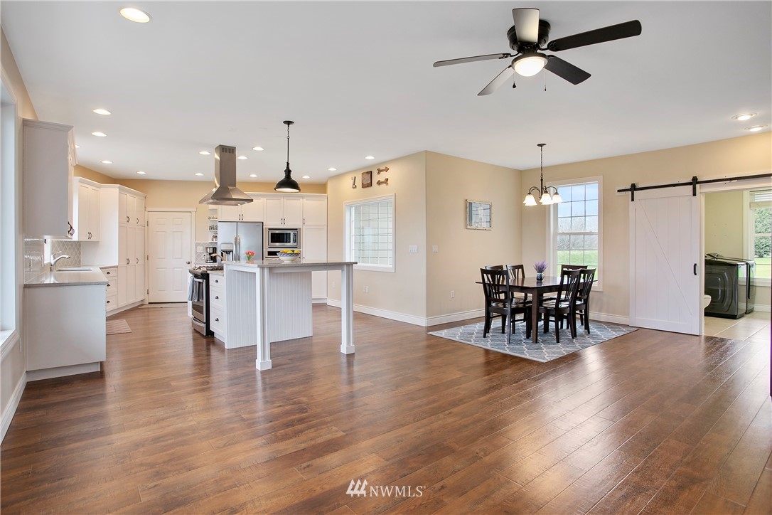 6580 Olson Road Ferndale, WA 98248 - Photo 10 of 38 a dining room with furniture and wooden floor