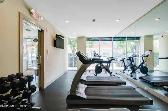 a view of a lobby with furniture and floor to ceiling window