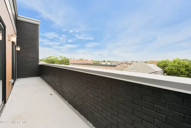 a view of balcony with furniture