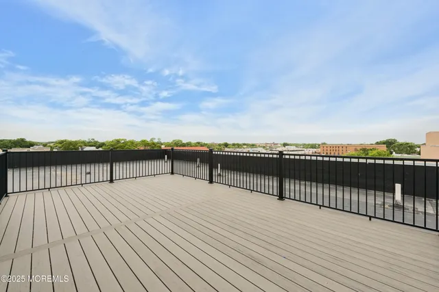 a view of roof deck with wooden floor