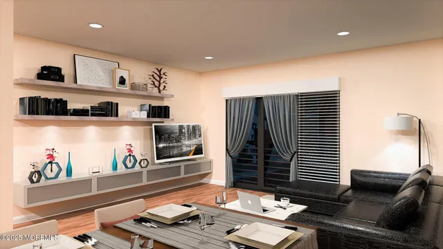 a living room with furniture and flat screen tv