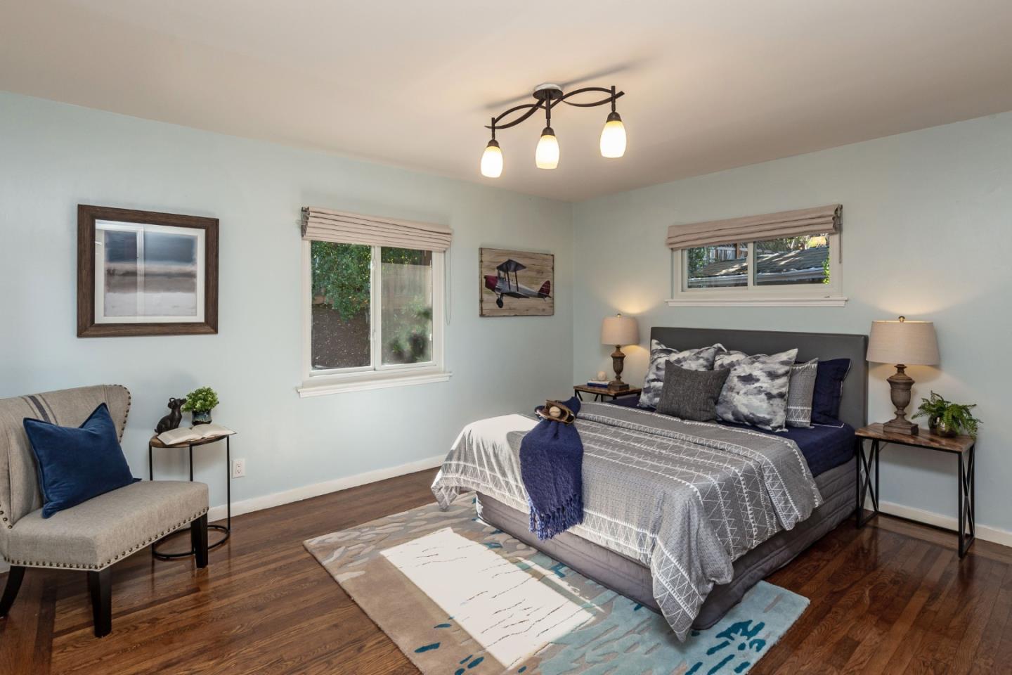 525 Outlook Drive Los Altos, CA 94024 - Photo 15 of 34 a bedroom with a bed and wooden floor