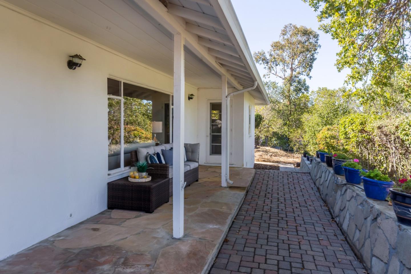 525 Outlook Drive Los Altos, CA 94024 - Photo 18 of 34 a backyard of a house with table and chairs