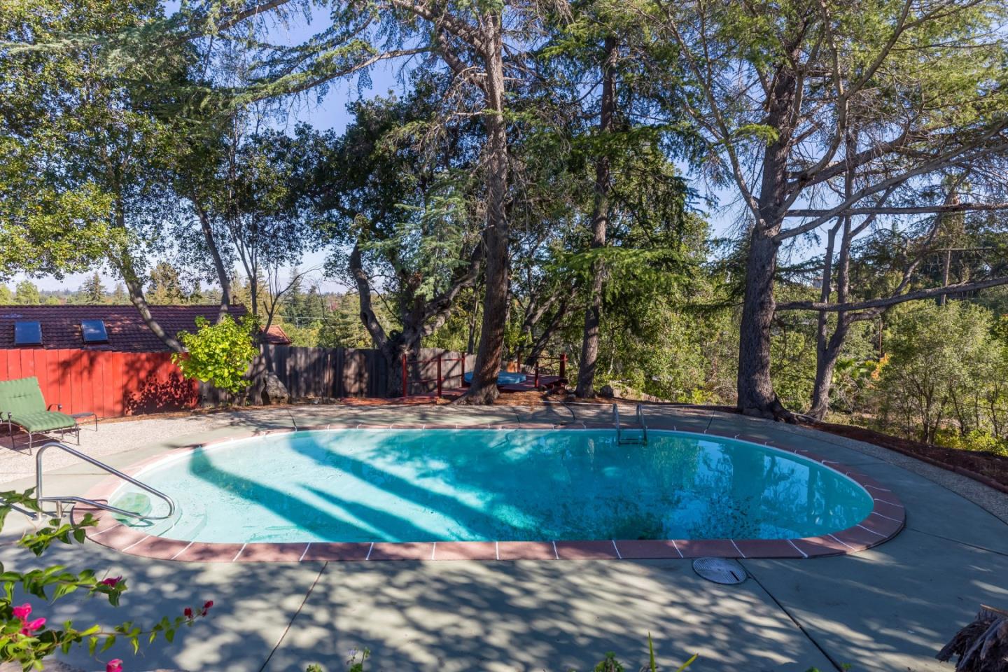 525 Outlook Drive Los Altos, CA 94024 - Photo 22 of 34 a view of backyard with swimming pool and seating space