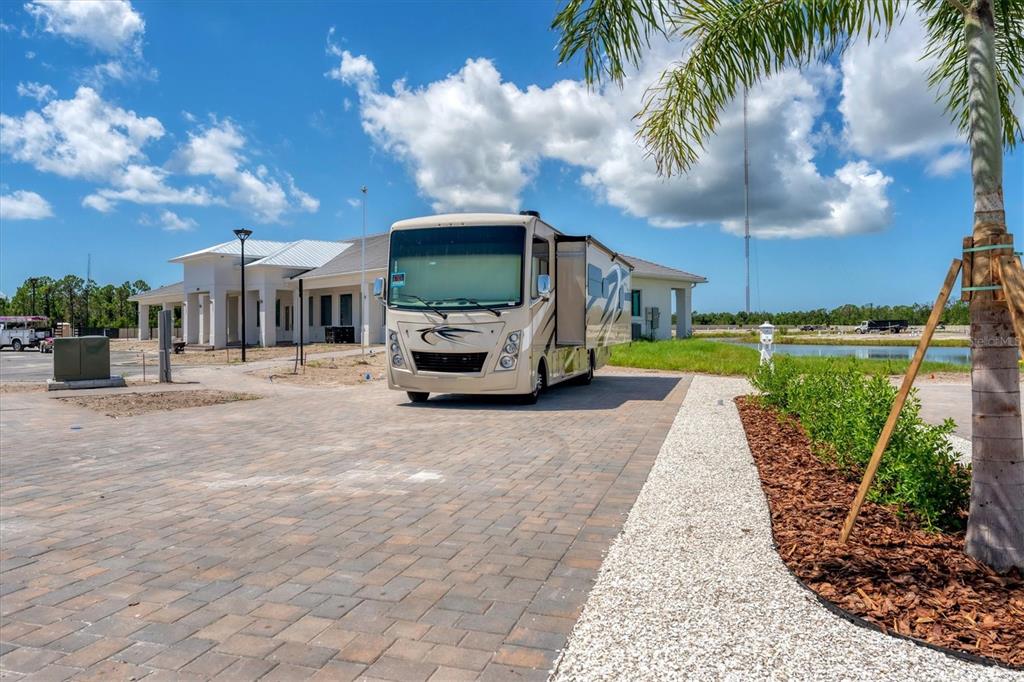 9001 Gasparilla Road, Unit 80 Placida, FL 33947 - Photo 22 of 78 a front view of a house with garden and trees