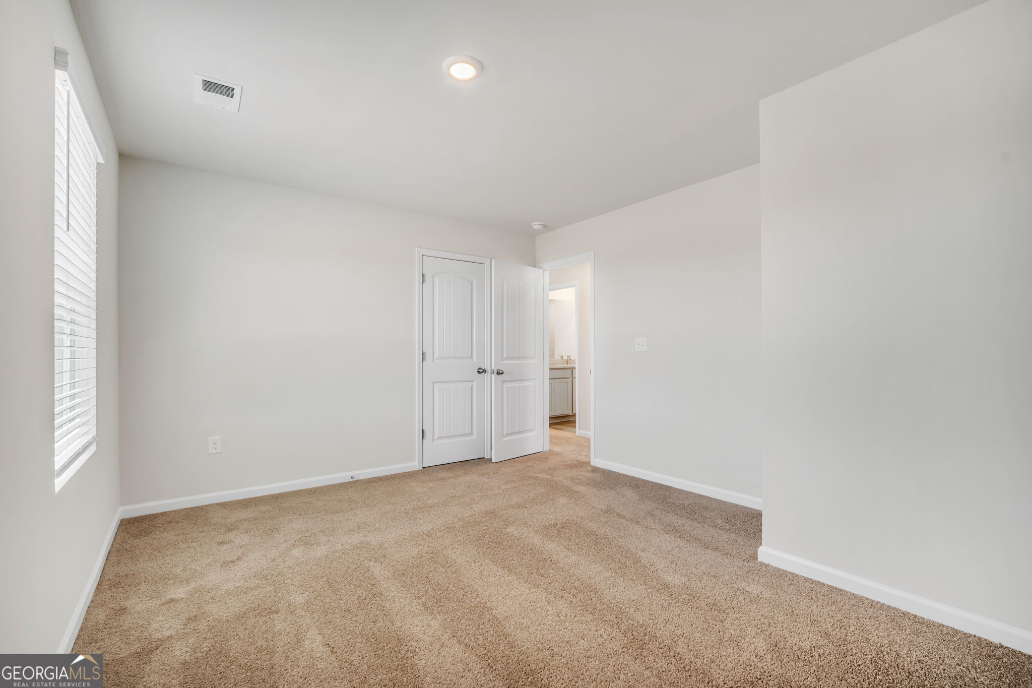305 Rusty Plow Lane, Unit 13 Perry, GA 31069 - Photo 13 of 25 an empty room with windows