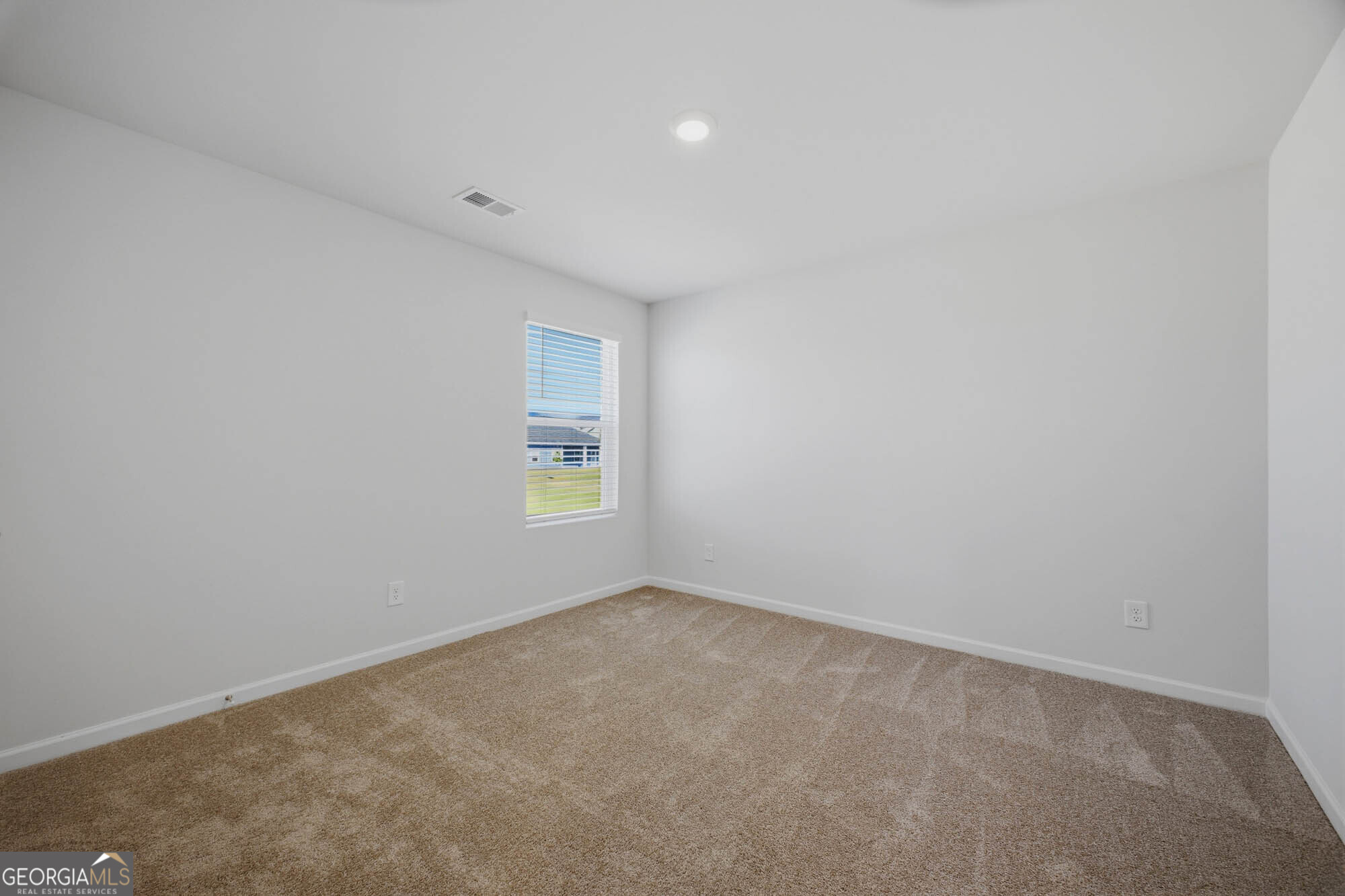 305 Rusty Plow Lane, Unit 13 Perry, GA 31069 - Photo 15 of 24 an empty room with windows