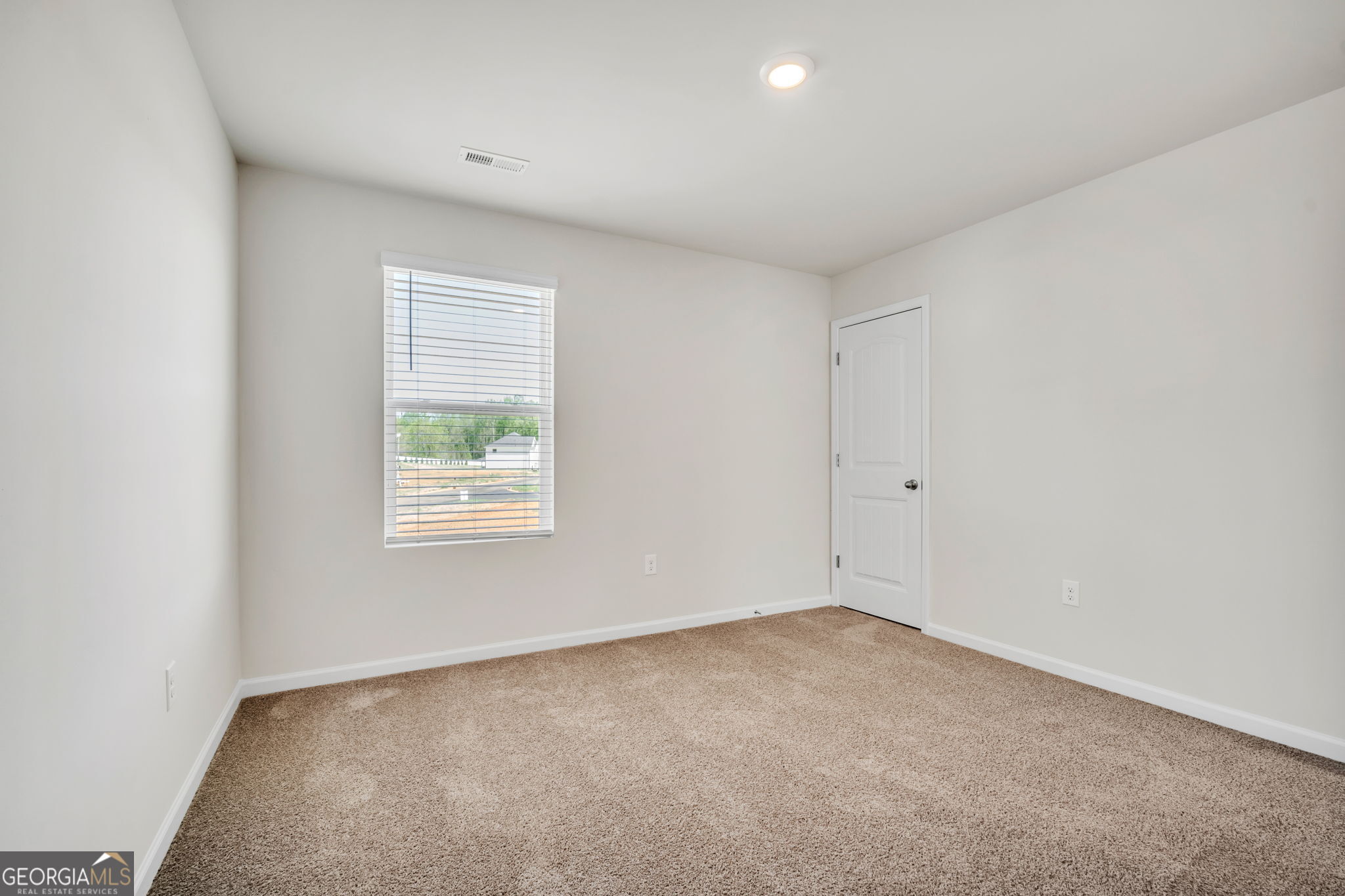 305 Rusty Plow Lane, Unit 13 Perry, GA 31069 - Photo 18 of 25 an empty room with windows