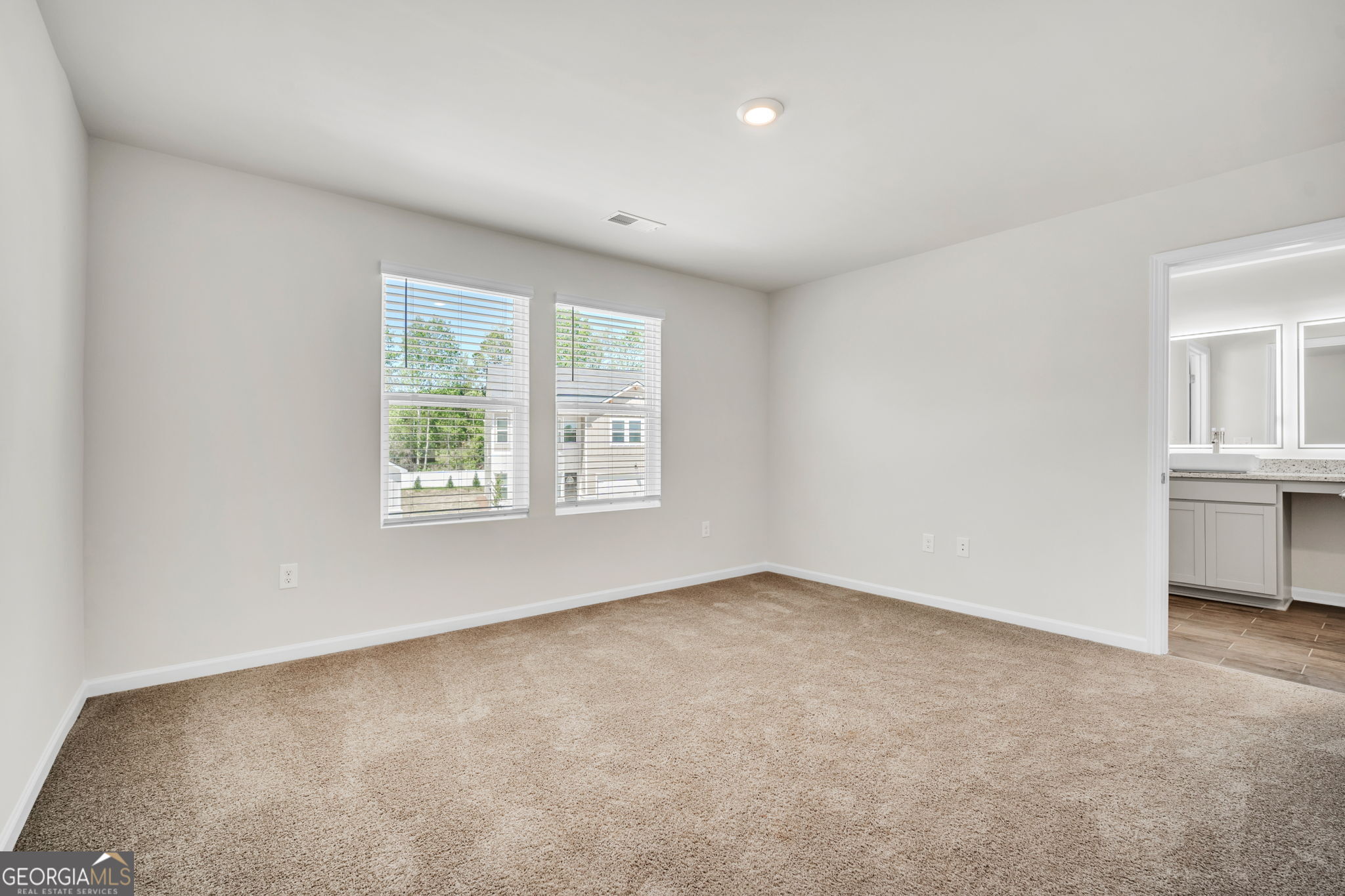 305 Rusty Plow Lane, Unit 13 Perry, GA 31069 - Photo 21 of 25 an empty room with windows