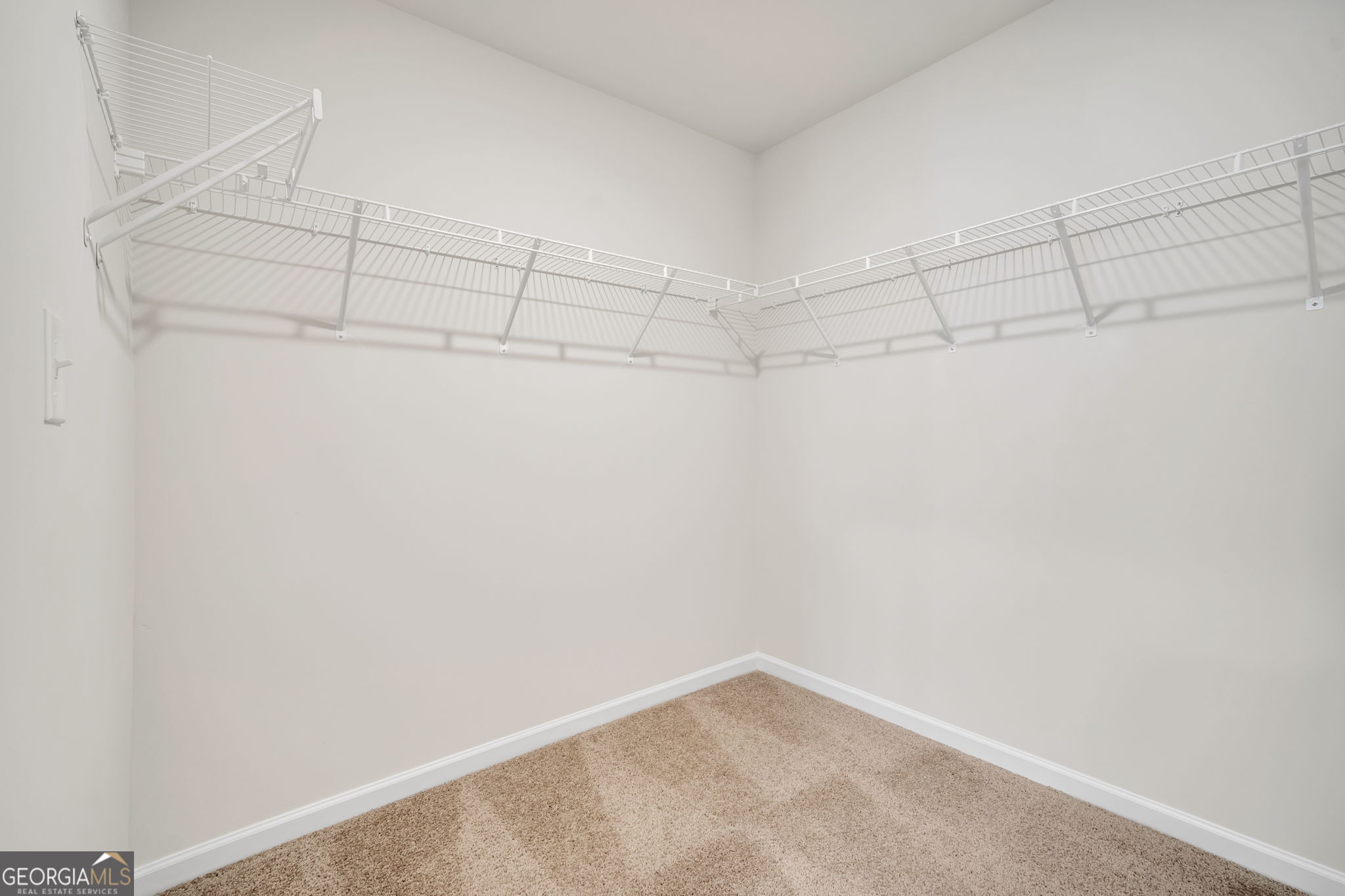 305 Rusty Plow Lane, Unit 13 Perry, GA 31069 - Photo 24 of 25 a view of a room with racks on the wall