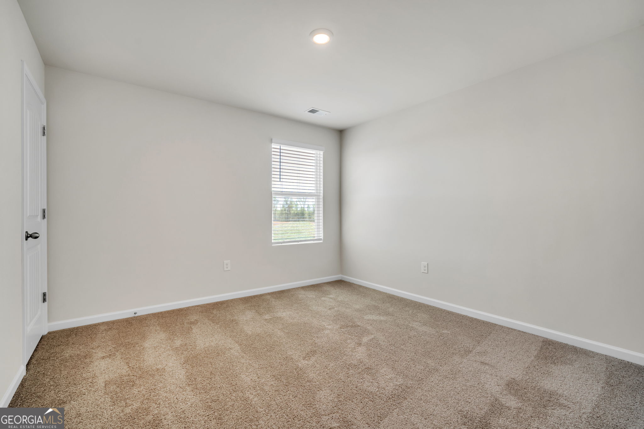 305 Rusty Plow Lane, Unit 13 Perry, GA 31069 - Photo 10 of 25 an empty room with windows
