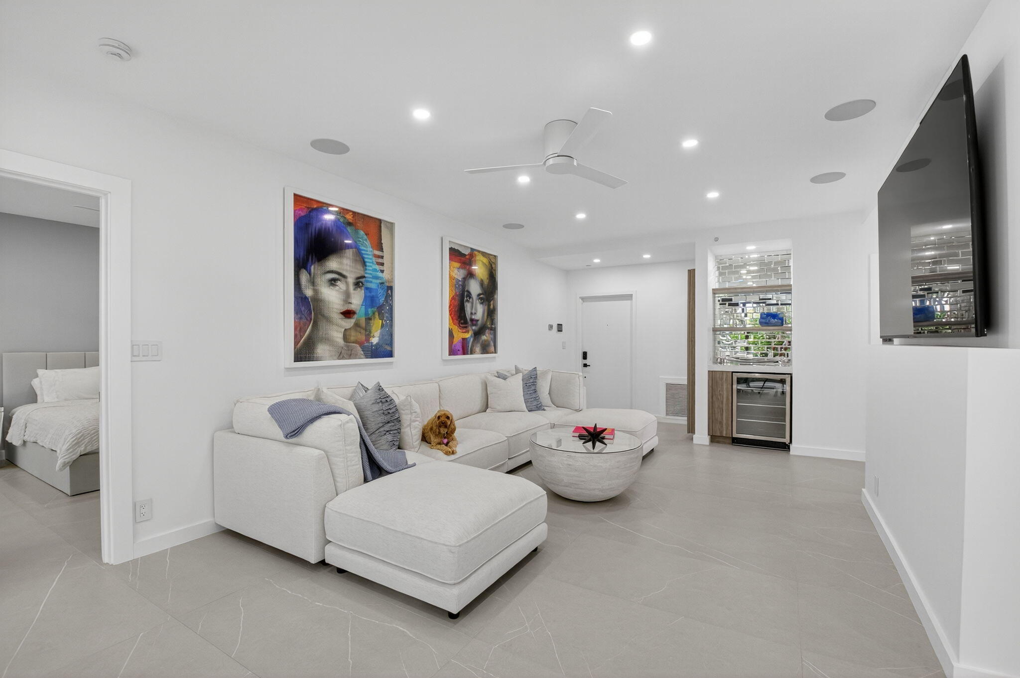 7847 Lakeside Boulevard, Unit 1014 Boca Raton, FL 33434 - Photo 17 of 53 a living room with furniture and a flat screen tv