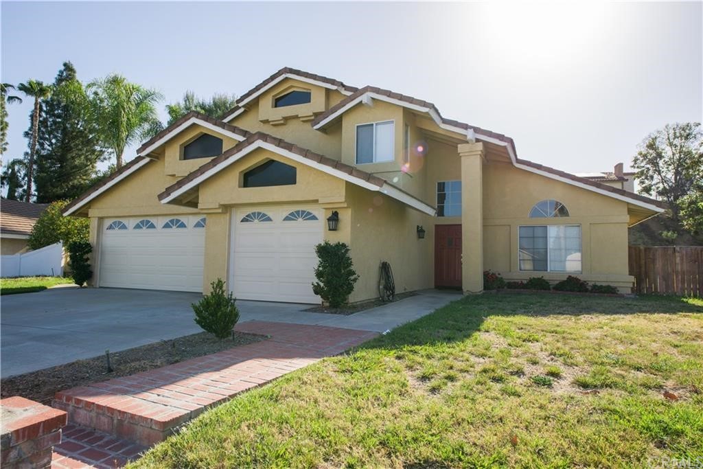 6728 Hawkley Drive Riverside, CA 92506 - Photo 1 of 1 a front view of a house with garden