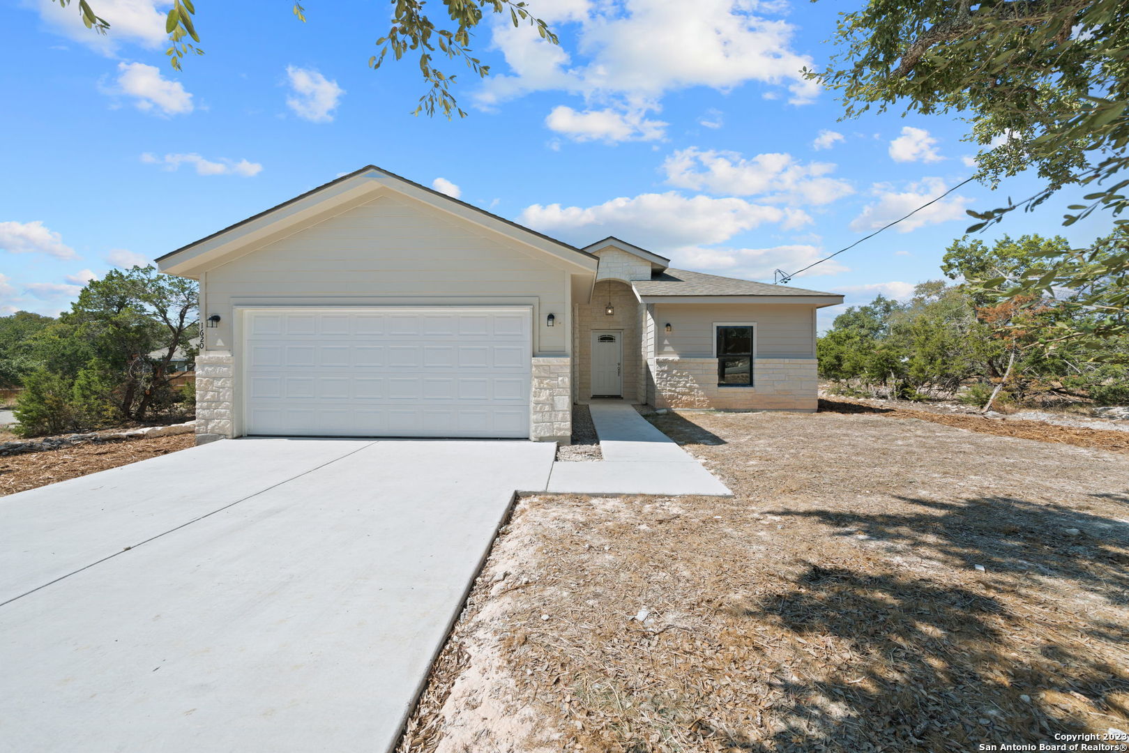 1620 Tanglewood Trail Spring Branch, TX 78070 - Photo 1 of 1 a view of garage and yard
