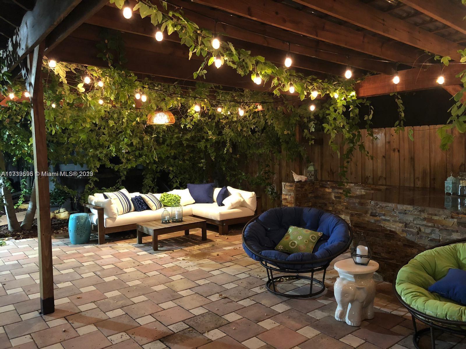 12015 Bird Road Miami, FL 33175 - Photo 14 of 16 a living room with furniture and a patio