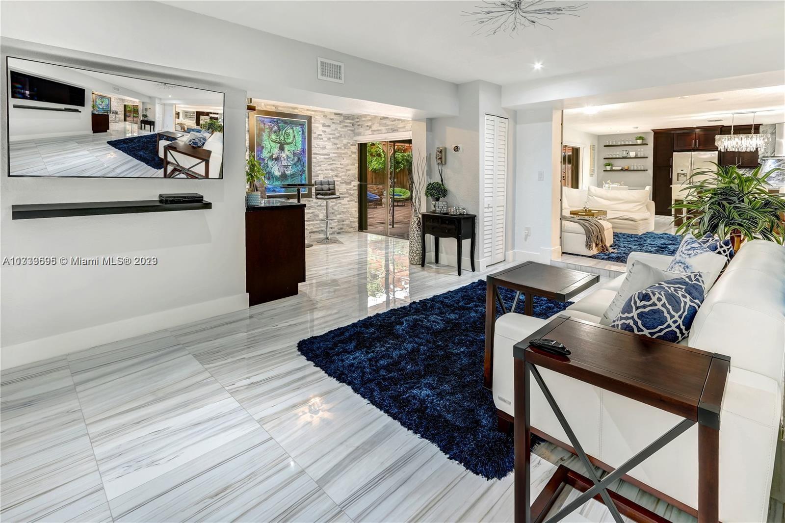 12015 Bird Road Miami, FL 33175 - Photo 2 of 16 a living room with furniture and wooden floor