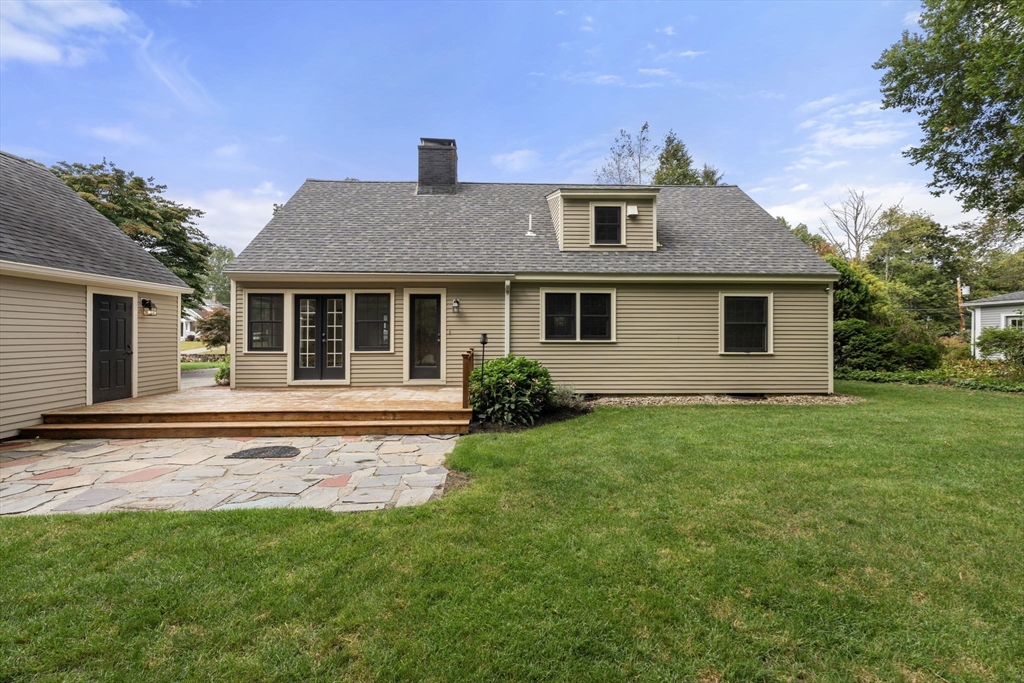 92 Abbot Street Andover, MA 01810 - Photo 33 of 35 a front view of a house with a garden