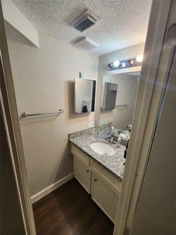 a bathroom with a sink and mirror