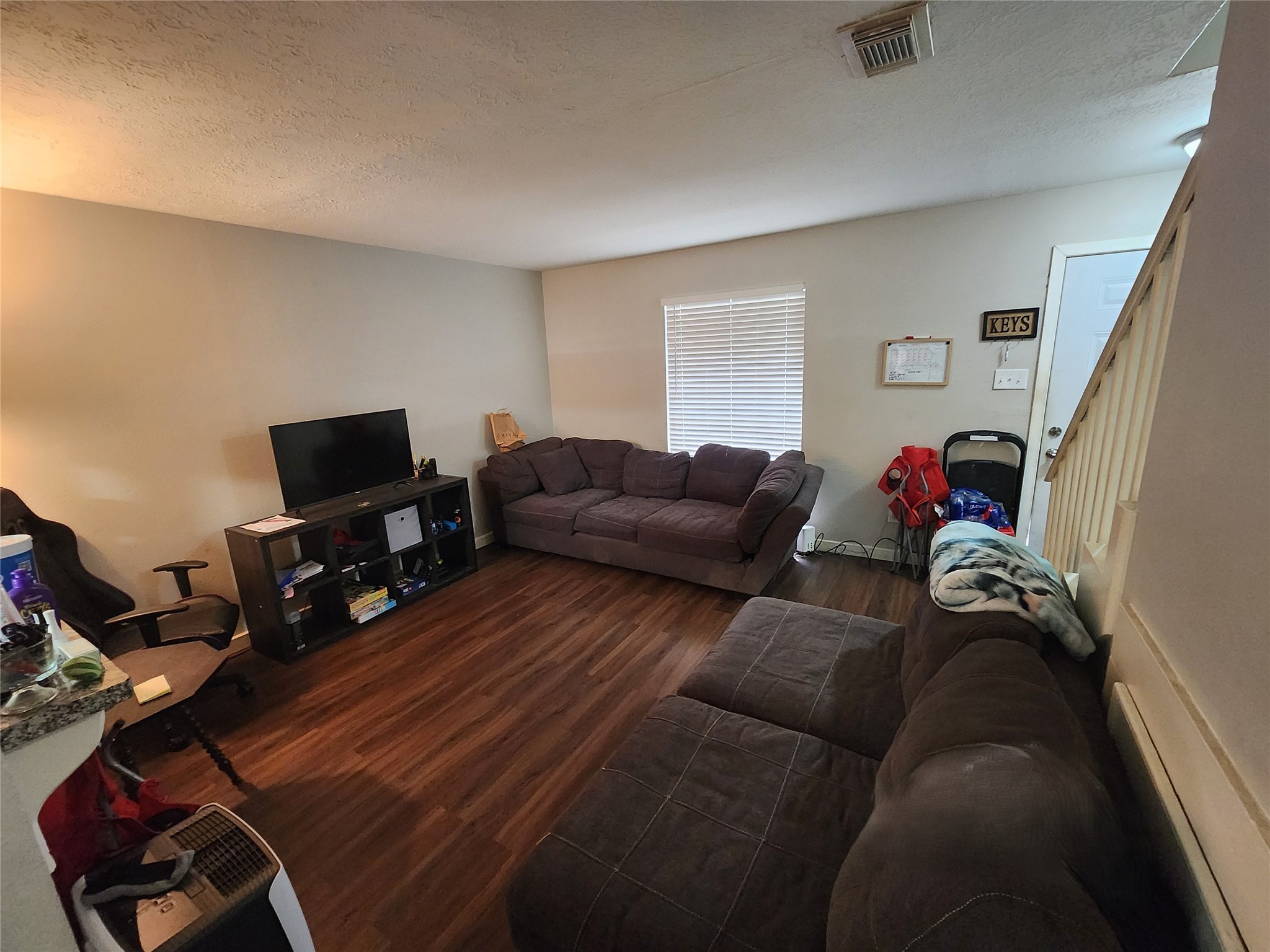 517 5th Street, Unit 4 Humble, TX 77338 - Photo 18 of 36 a living room with furniture and a flat screen tv