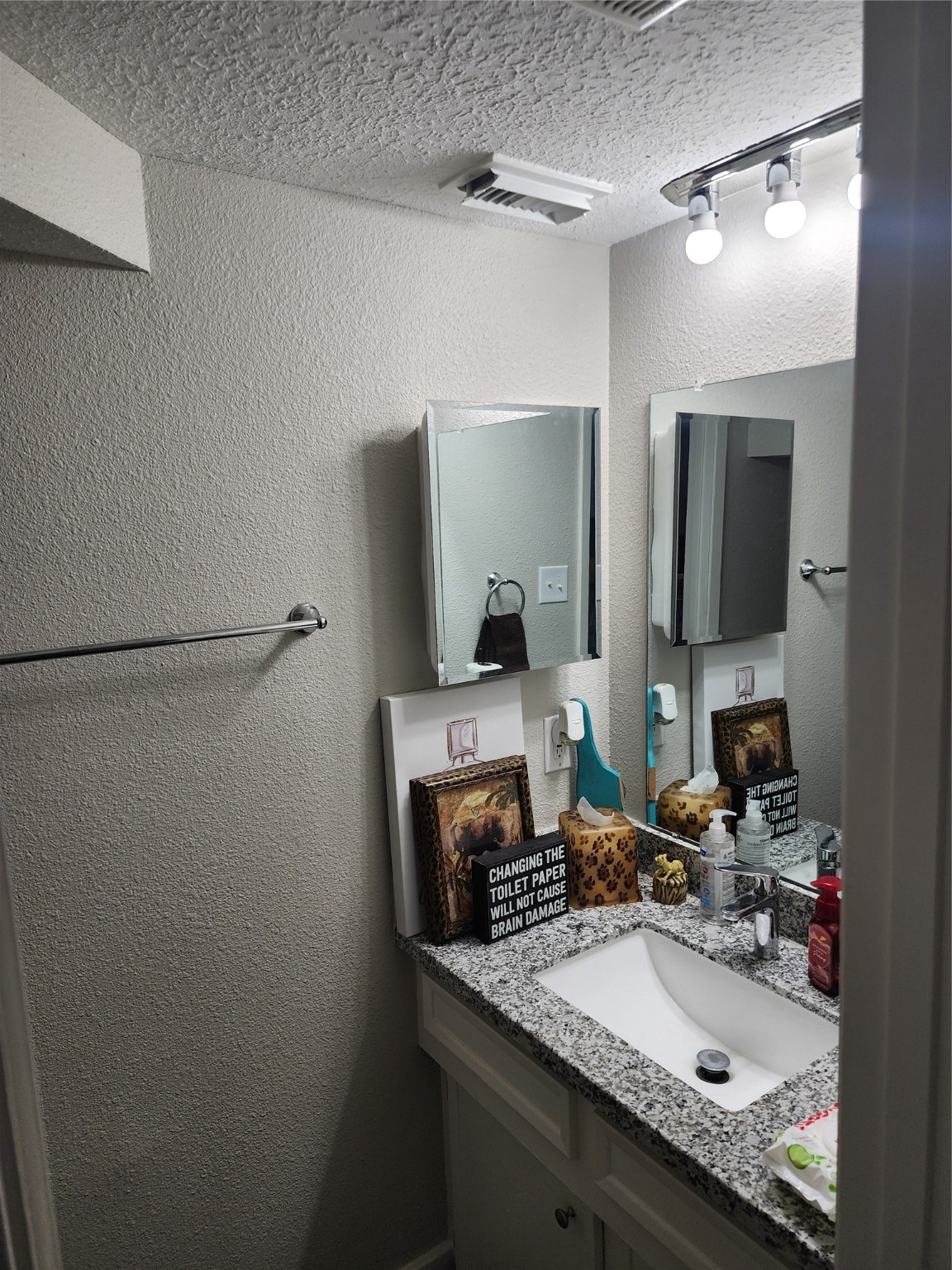517 5th Street, Unit 4 Humble, TX 77338 - Photo 26 of 36 a bathroom with a granite countertop sink and a mirror