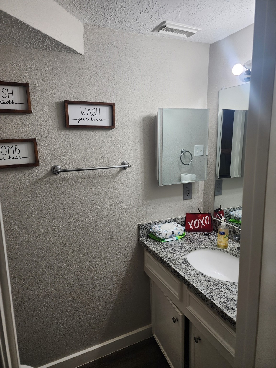 517 5th Street, Unit 4 Humble, TX 77338 - Photo 32 of 36 a bathroom with a granite countertop sink a vanity and a shower