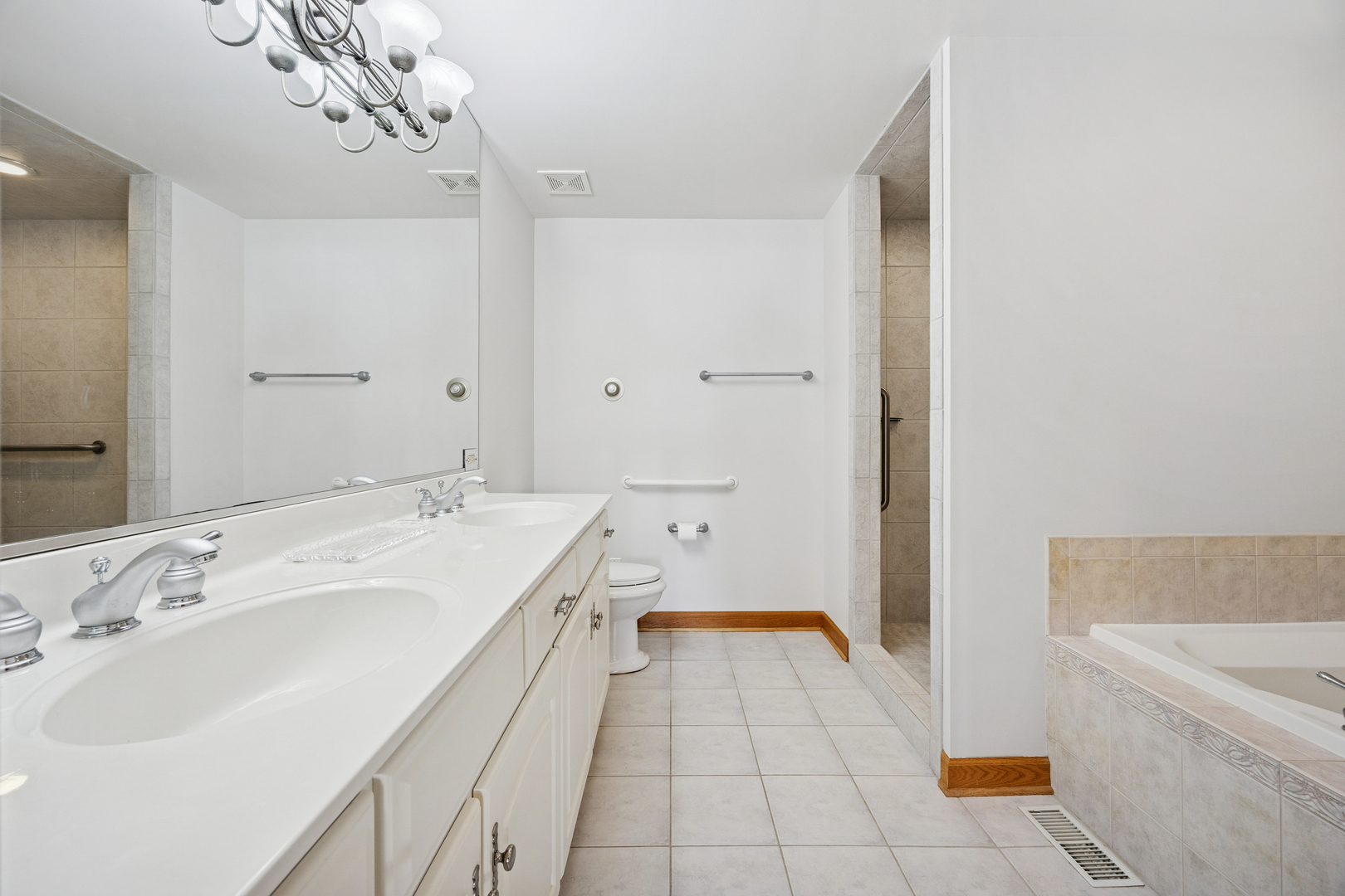 13773 Steeples Road Lemont, IL 60439 - Photo 11 of 30 a spacious bathroom with a tub sink and mirror