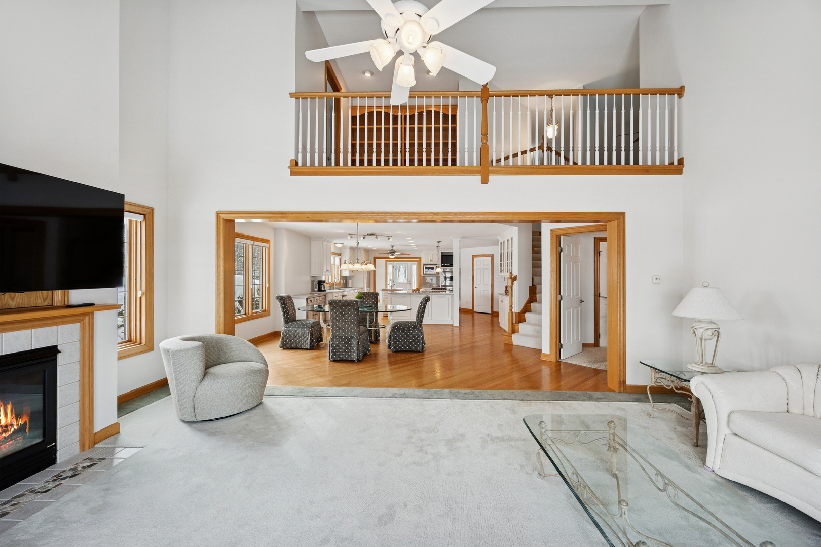 13773 Steeples Road Lemont, IL 60439 - Photo 15 of 30 a living room with furniture a flat screen tv and a fireplace